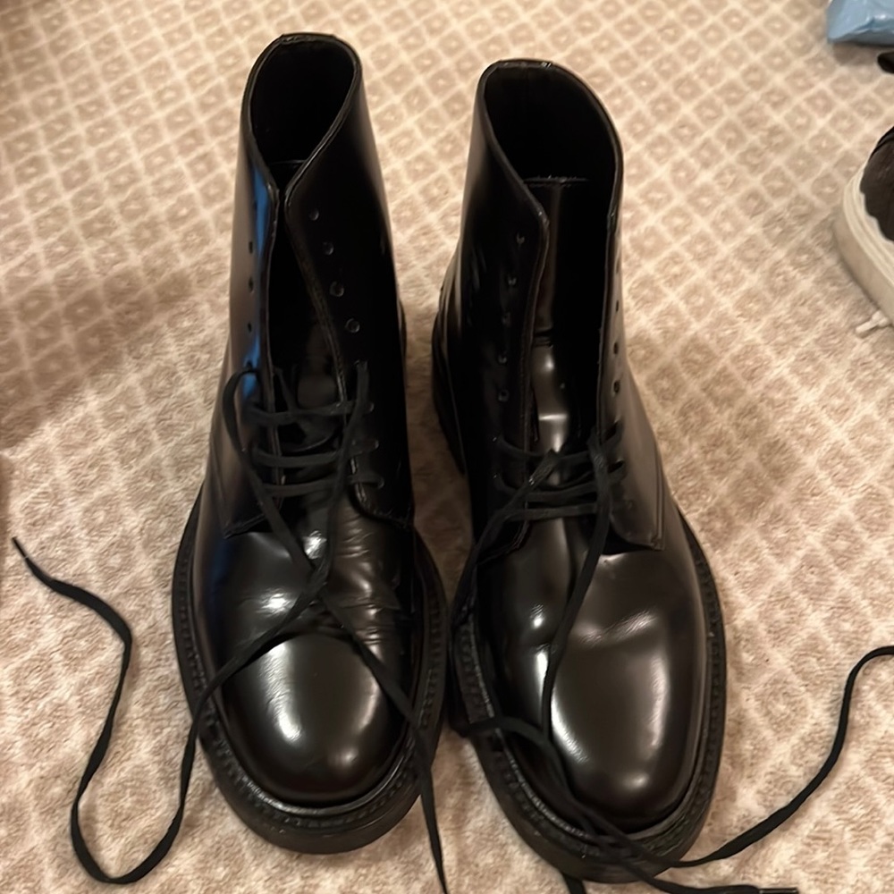 Black Saint Laurent combat boots.
